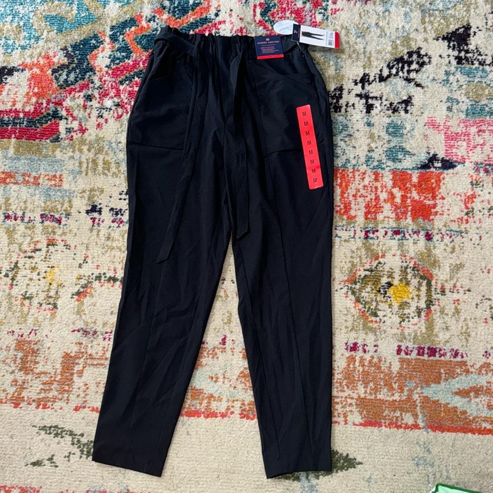 Black, straight legged, paper bag dress pants. New with tags. Size medium